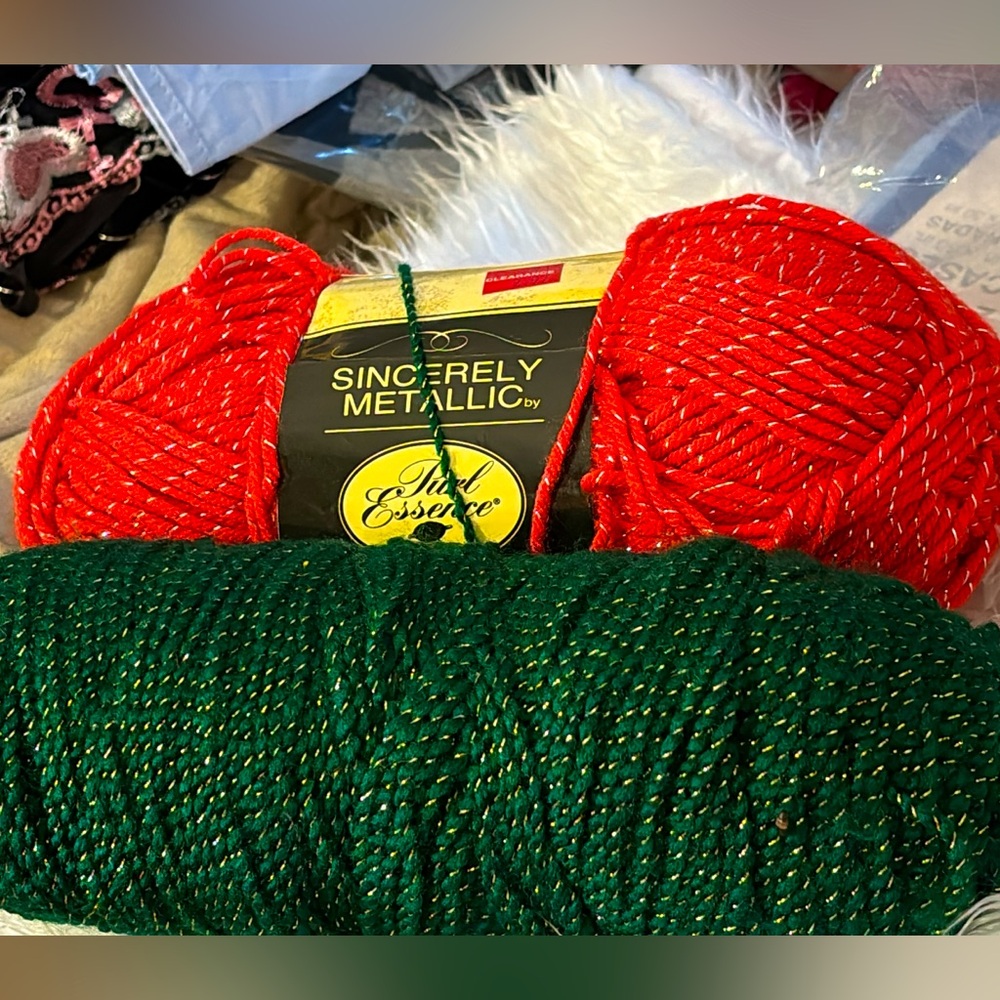 2 skeinss of Christmas 🎅 color yarn they are both have gold running through them